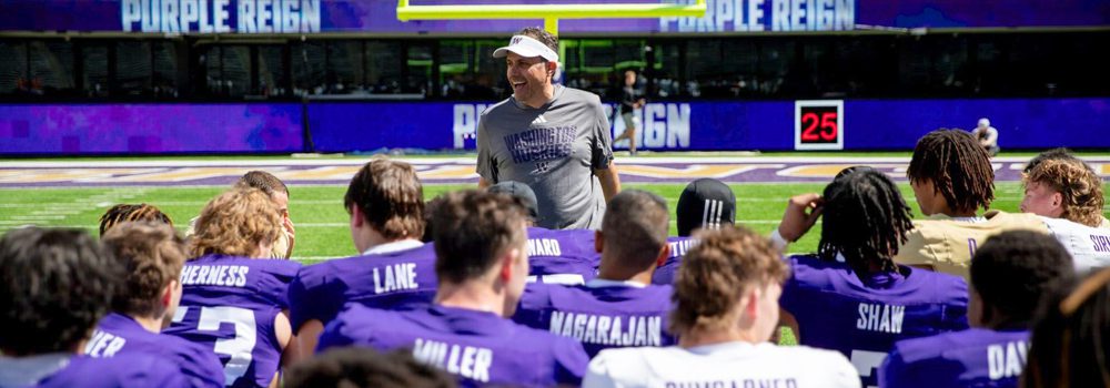 Coach Fisch talks to Football team during practice