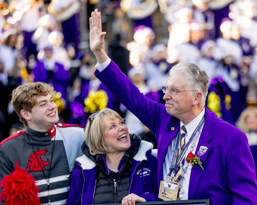 Brad with wife Janie and son Skylar getting recognized on the field at Husky Stadium