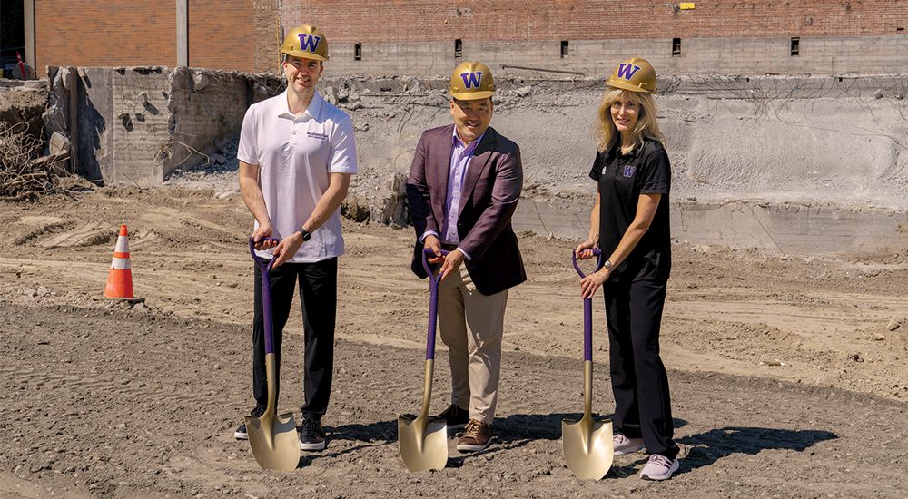 Athletic Director Pat Chun, Coach Sprinkle and Coach Langley holding shovels at the groundbreaking ceremony